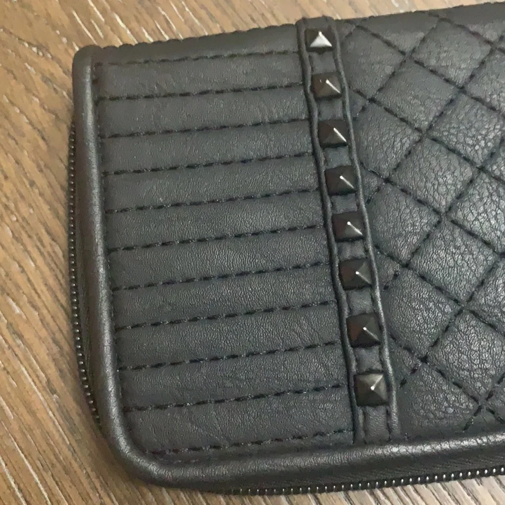 Unbranded black with black brads wristlets
